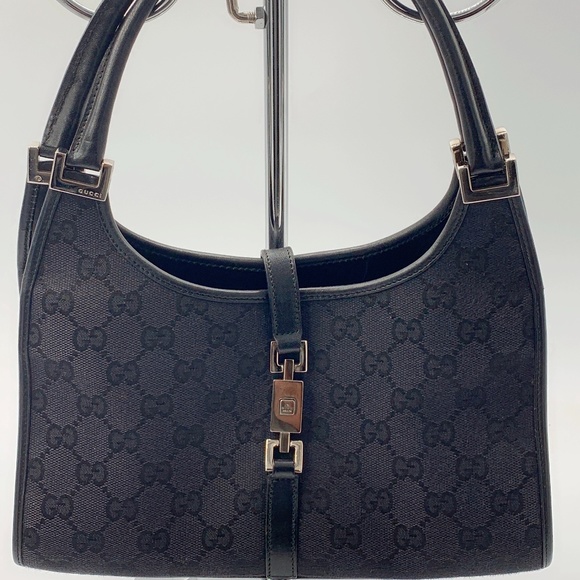 Gucci Handbags - Authentic Gucci GG Black Canvas Push lock Bag